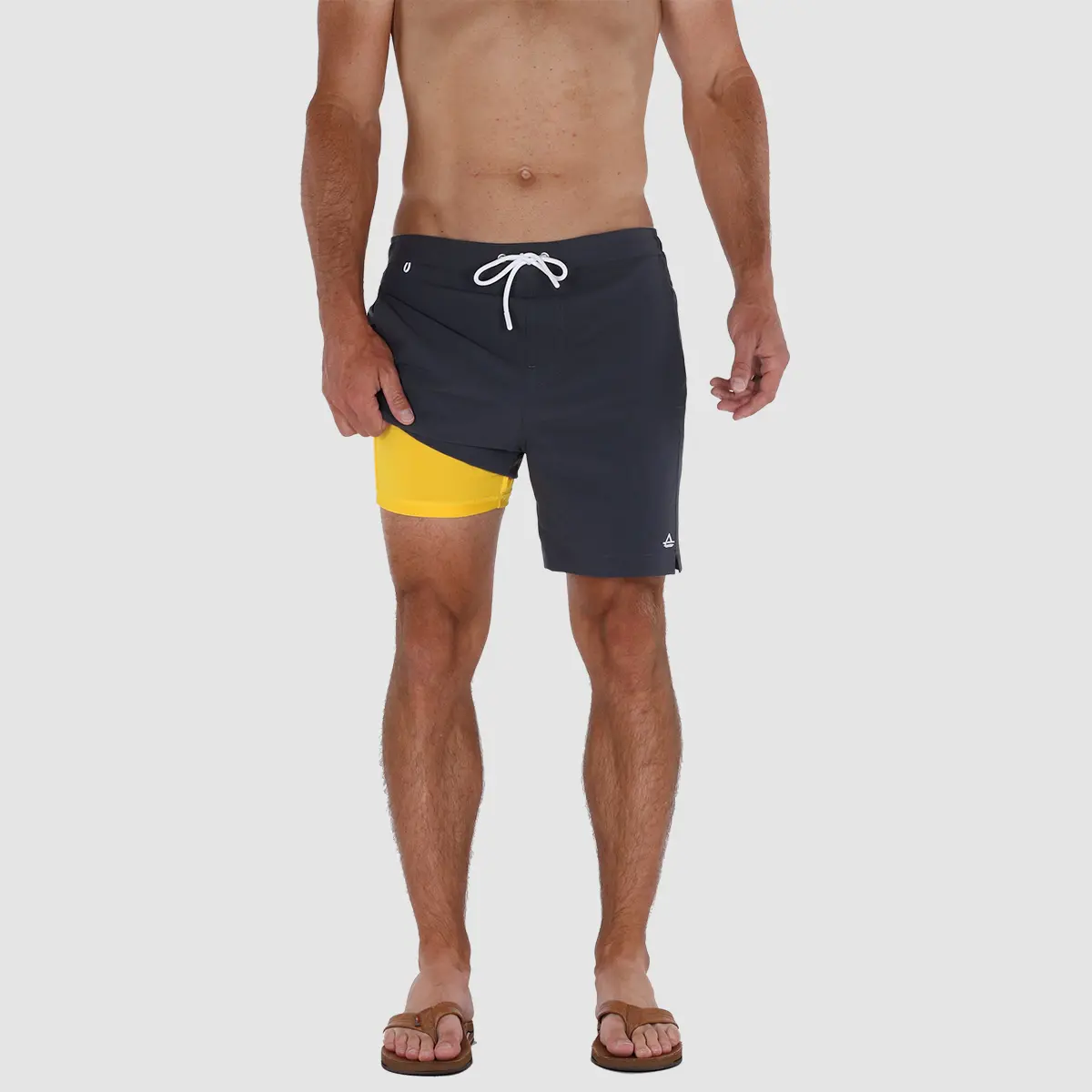 https://www.avalonsupply.com/wp-content/uploads/2022/08/mens-6-inch-inseam-swim-trunks-with-compression-liner-avalon-classics-charcoal-02.jpg
